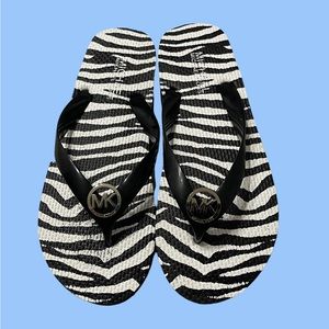 New Michael Kors Zebra print size 7 flip flops